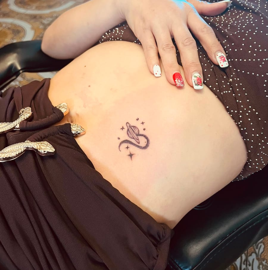 Spider lily with script tattoo